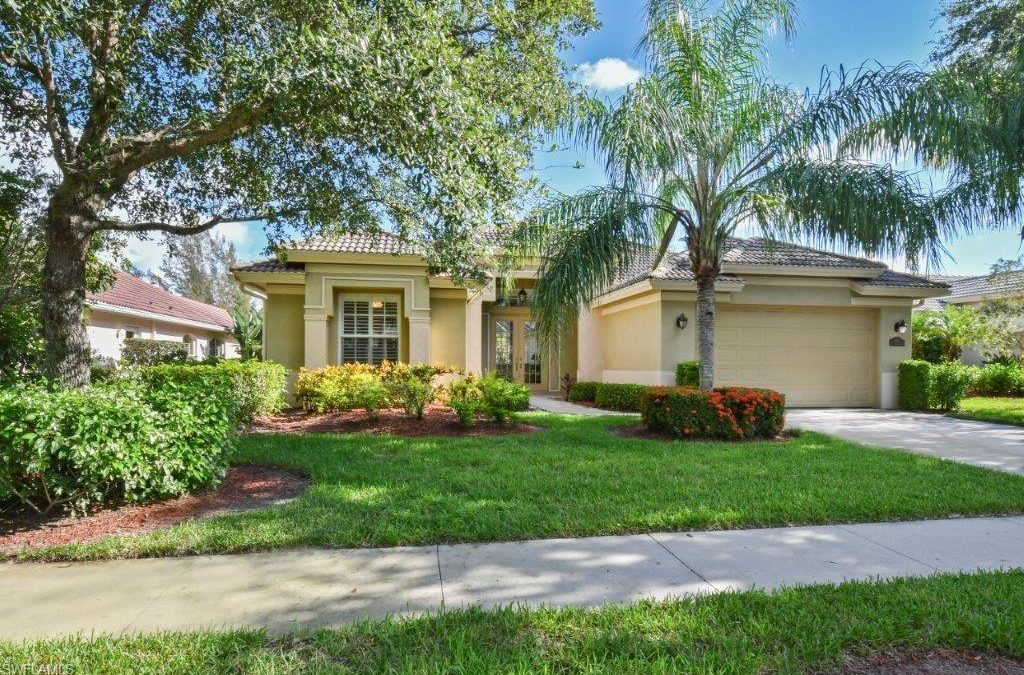The Picture describes a house blue sky trees and palm in Briawood Naples Fl