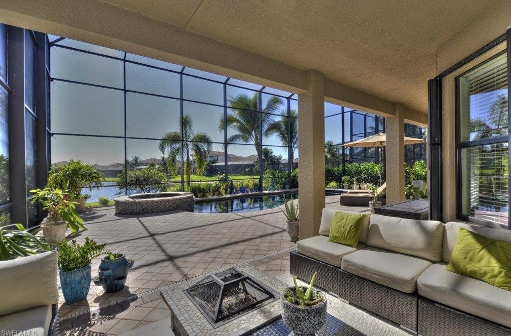 the picture shows an Outdoor Area with pool in Riverstone Naples, FL