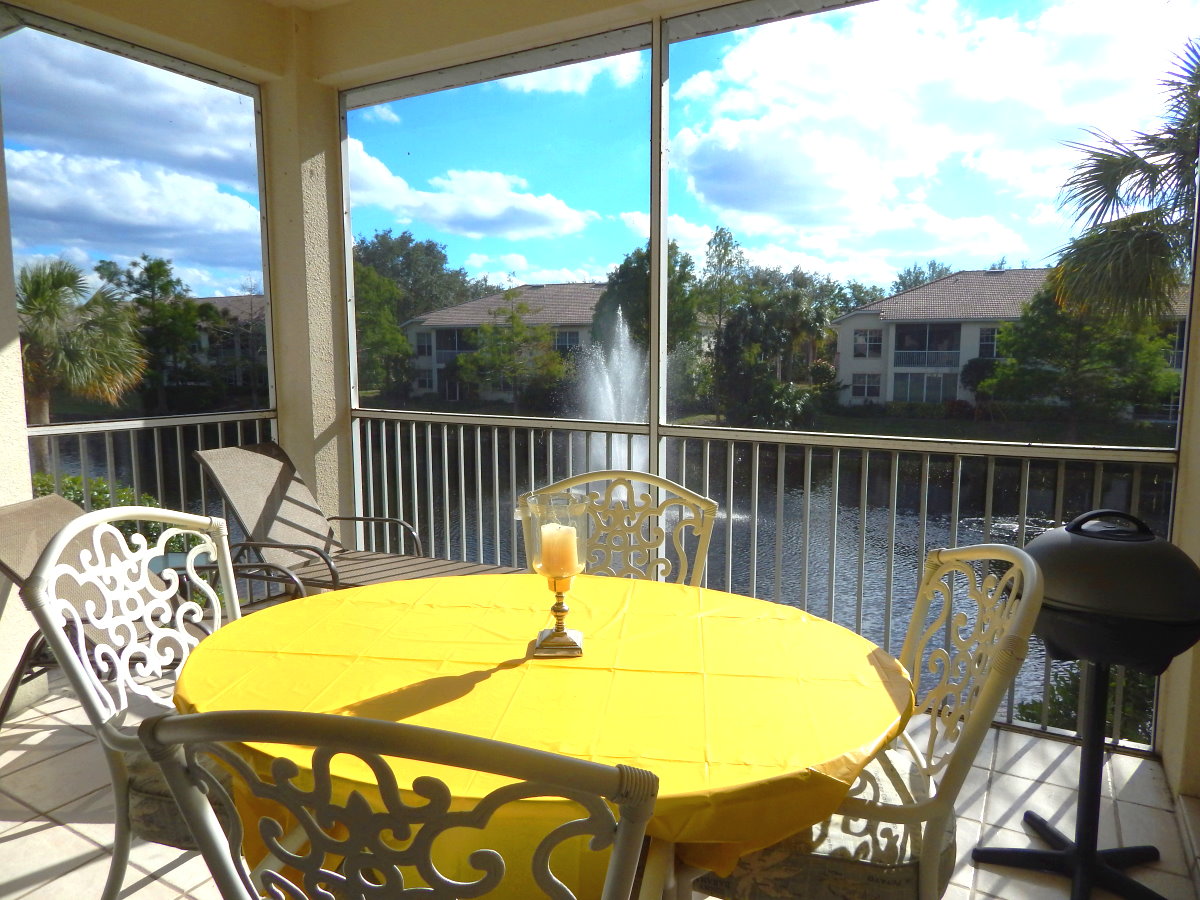 Picture Describes a patio with a table and chairs view to the lake