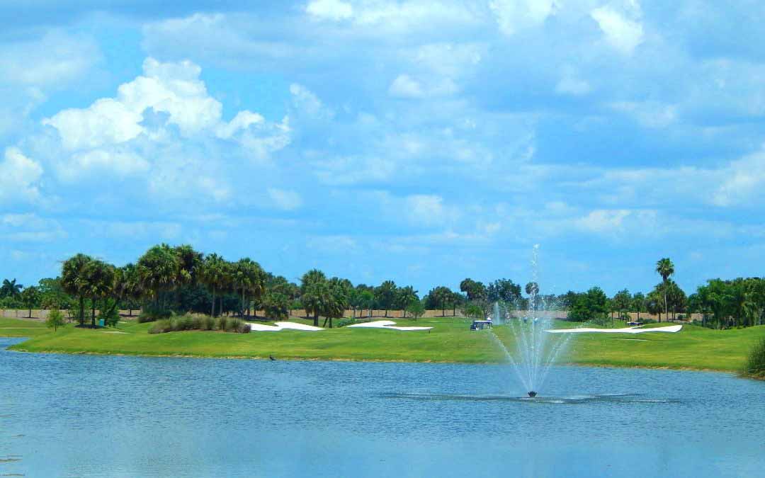 Golf Course, lake, blue sky in Naples Florida, The Strand Golf Community