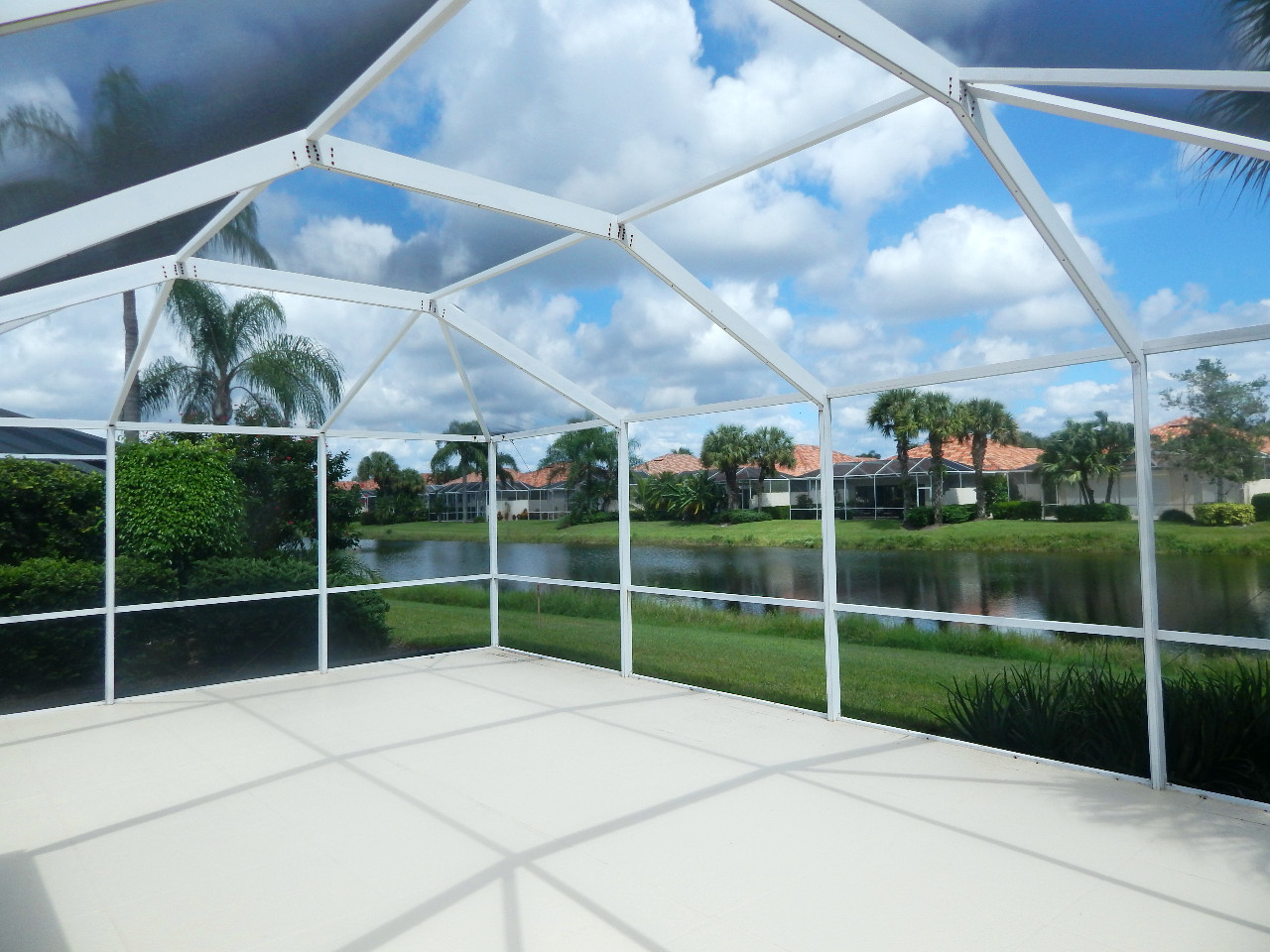The image describes a screened patio and a lake view
