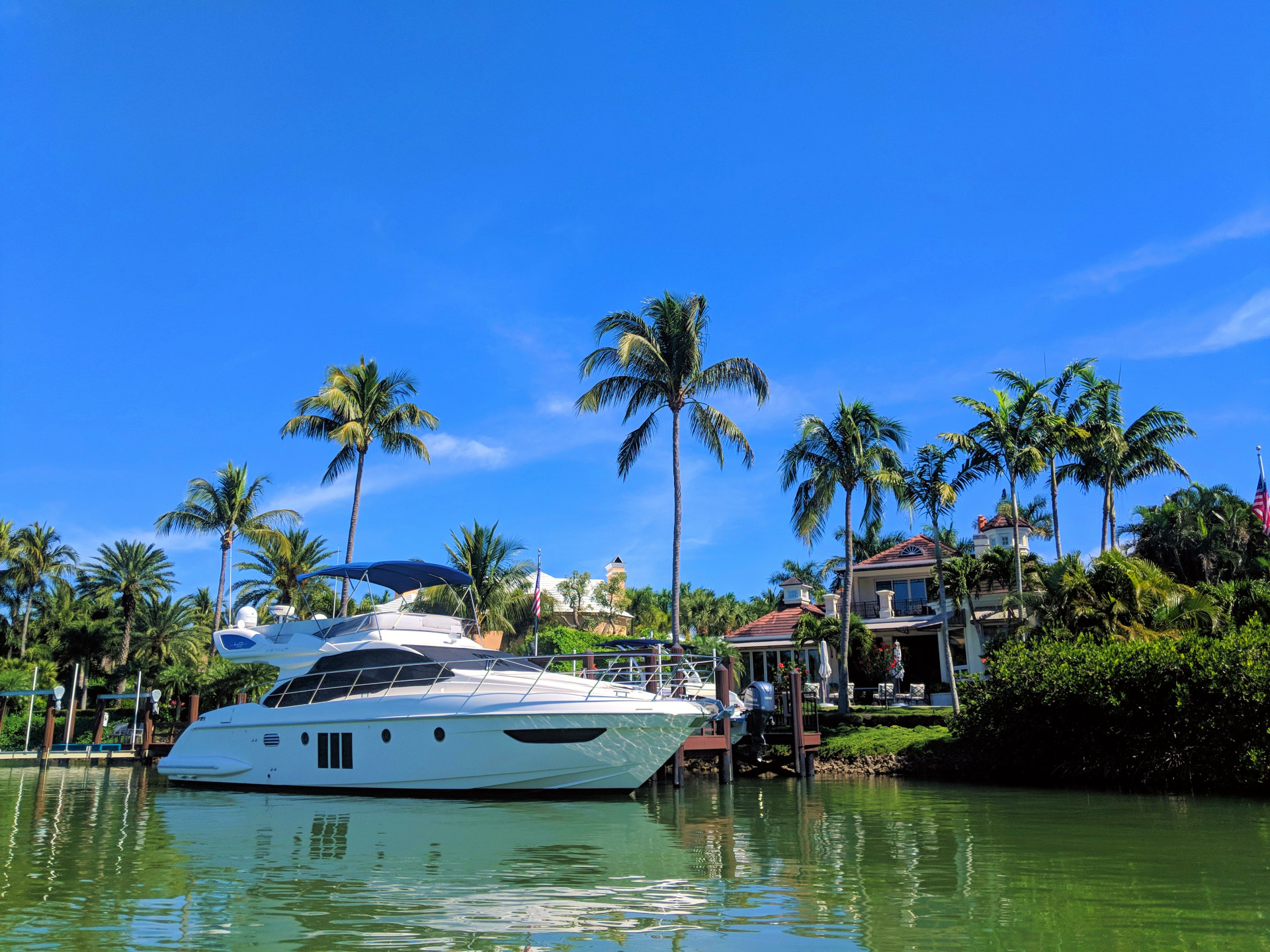 Luxury waterfront estate in Port Royal Naples with private boat dock and yacht