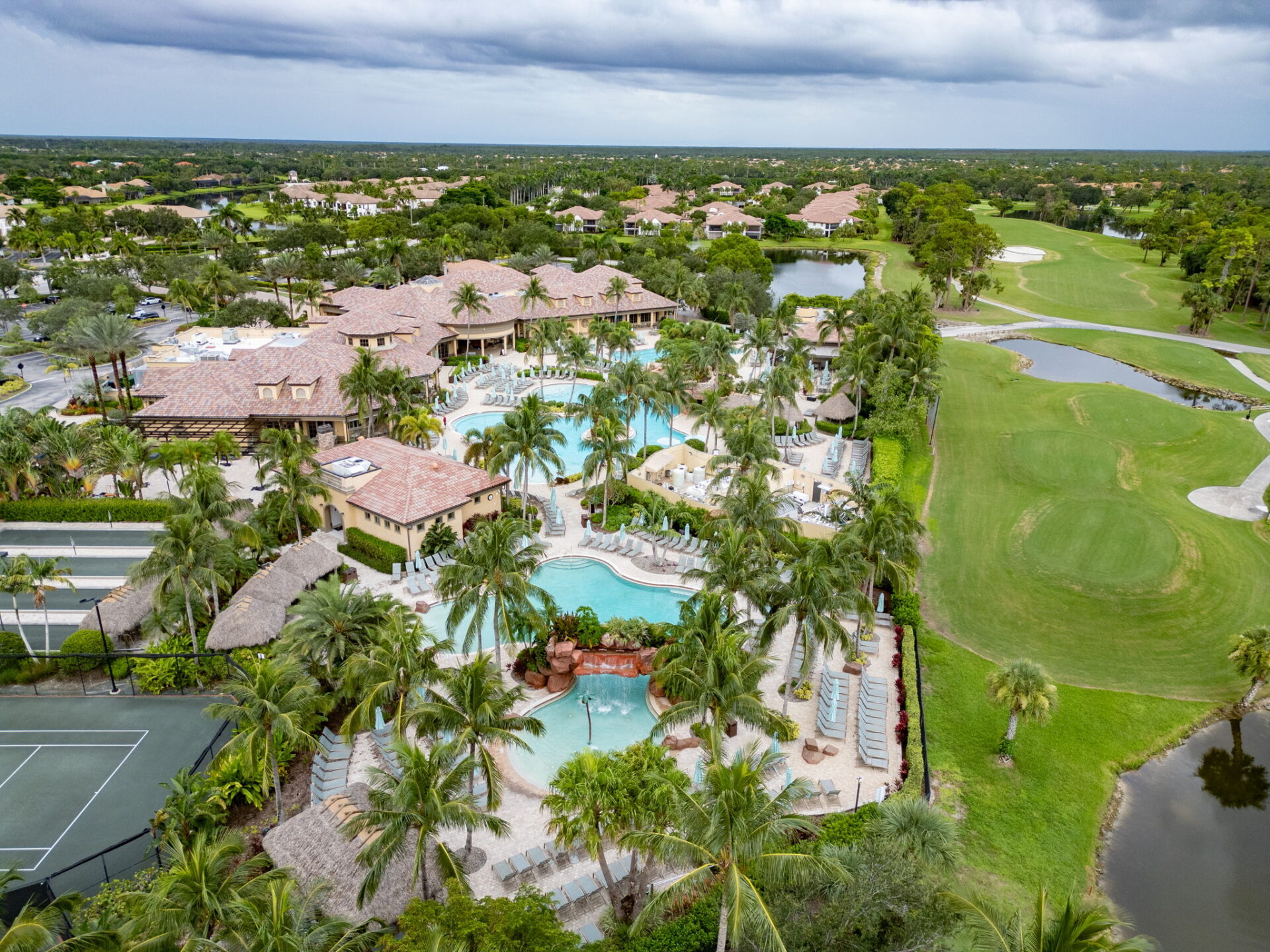 Showing a resort pool and golf course