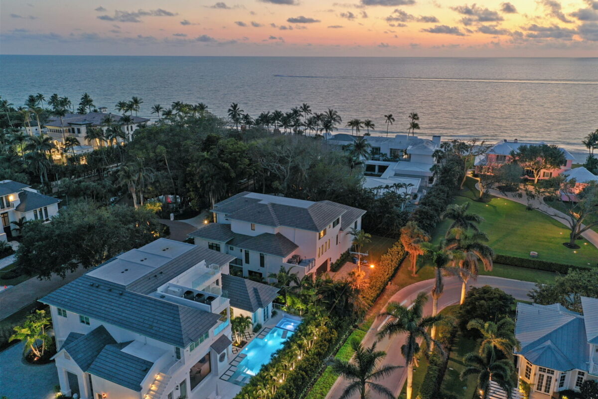 Aerial view of luxury coastal homes in Naples Florida at sunset