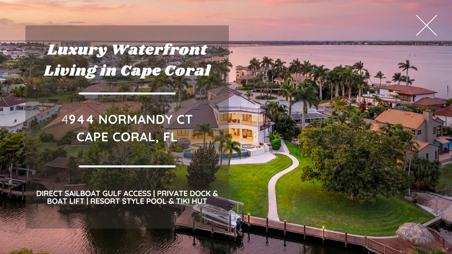 Luxury waterfront home at 4944 Normandy Ct in Cape Coral, Florida at sunset with Gulf access, private boat dock, pool, tiki hut and panoramic water views